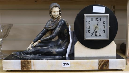 An Art Deco spelter and marble figural mantel clock with movement